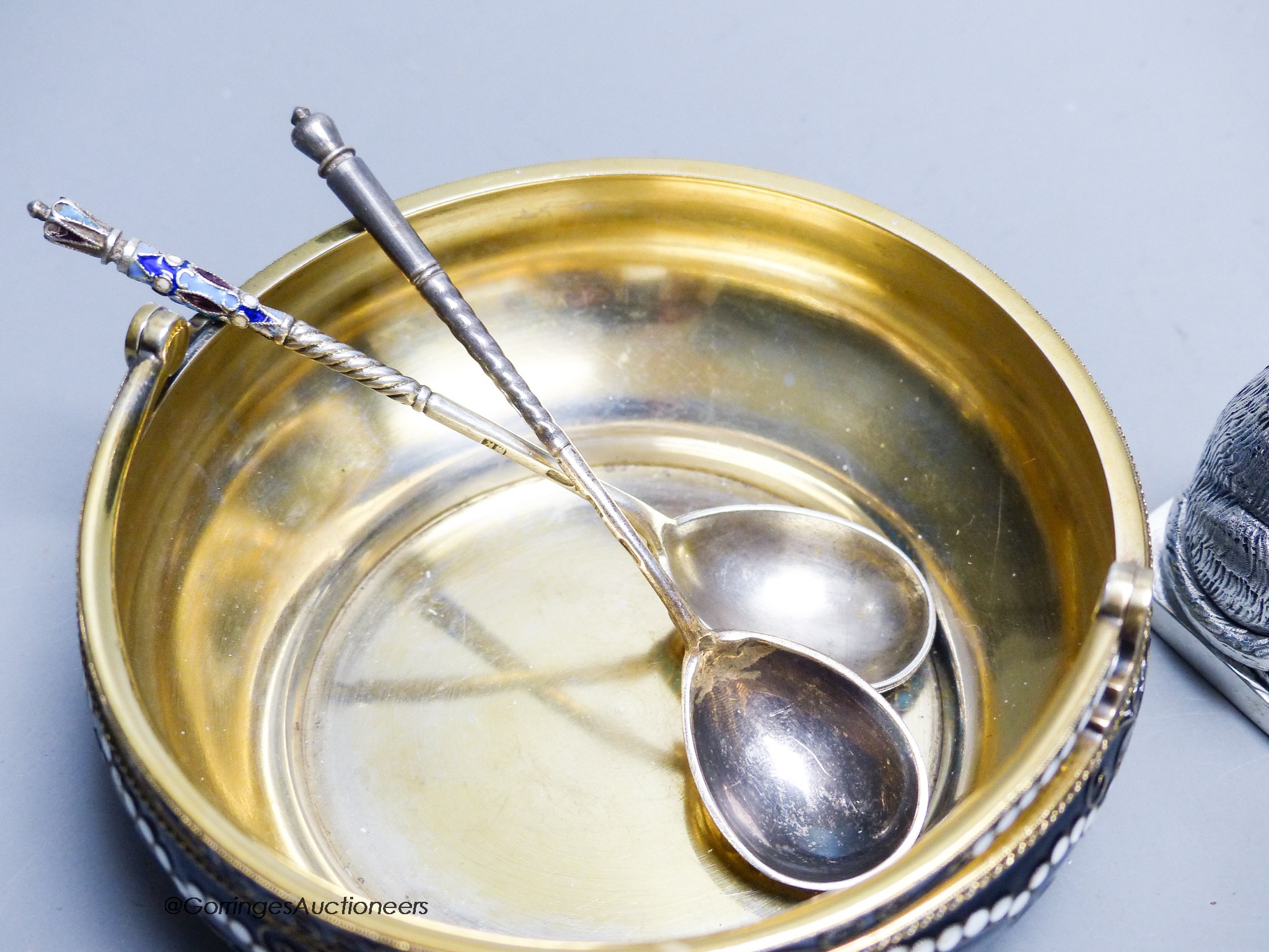 A group of Russian style metalware and a silver and enamel basket